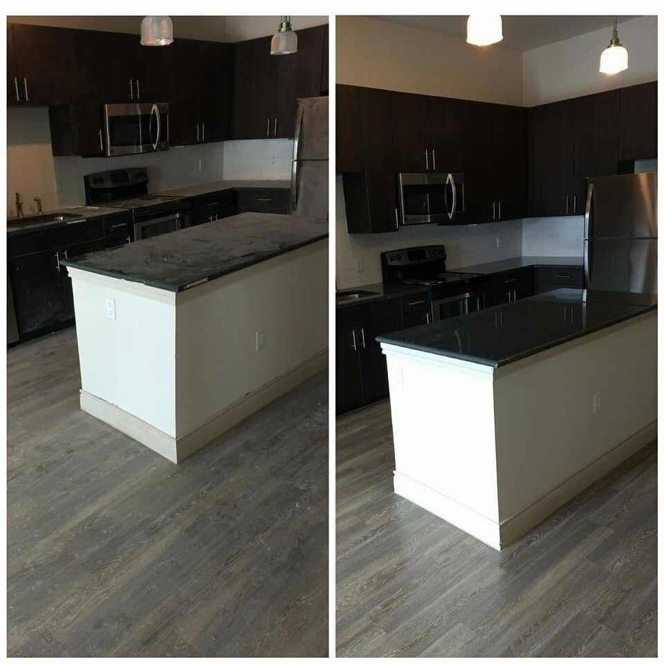 A second turned kitchen with island and stainless appliances