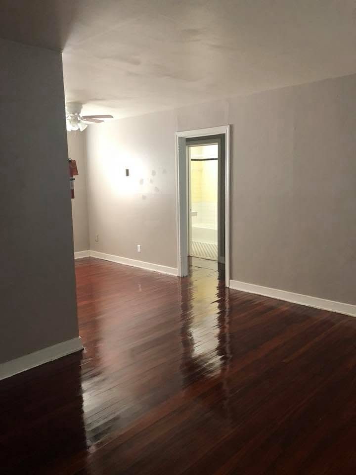 A repainted unit with refinished wood floors