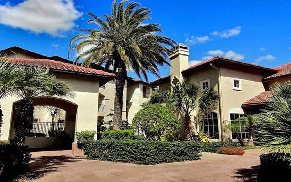 A freshly painted stucco apartment community
