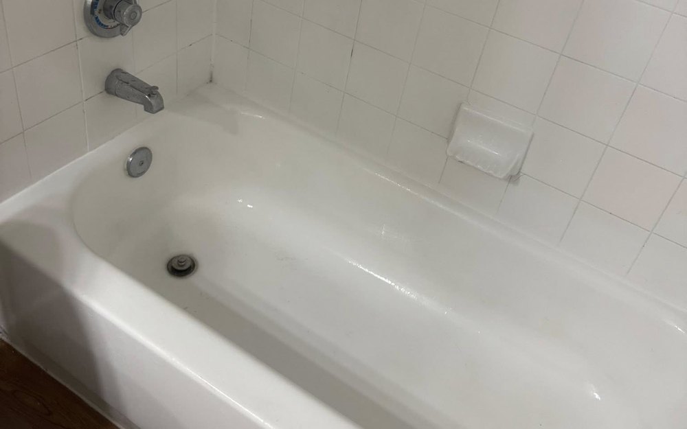 A resurfaced apartment tub, glossy white